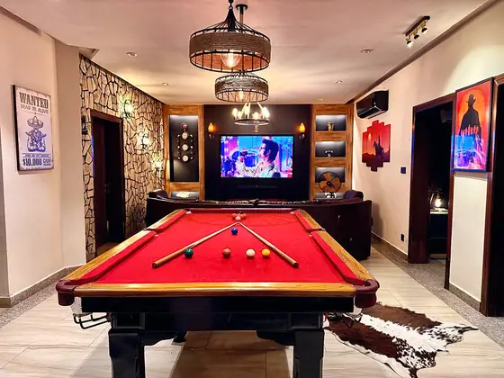 Pool tables, fireplaces and a starlight cinema. Full-size pool and snooker tables with cues, electric fireplaces under the TV and a fibre-optic starry-ceiling home cinema.